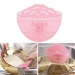 Person with rice wash sieve Australia Pink color, front view, showing perforated design.