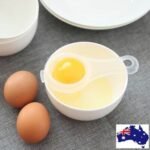Person with egg yolk separator Australia Clear color, front view, showing strainer design.