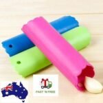 Person with garlic peeler Australia Random color silicone, front view, showing tube design.