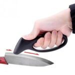 Person with knife sharpener Australia Black color, front view, showing sharpening slots.