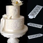 Person with damask cake mold Australia White color, front view, showing lace design.
