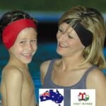 Person with swim ear band Australia Black color, front view, showing neoprene fit.