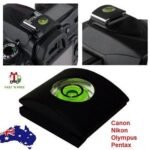 DSLR hot shoe protector Australia Black rubber, front view, showing spirit level.