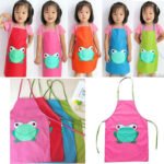 Kids waterproof apron Australia Green with frog, front view, showing full design.