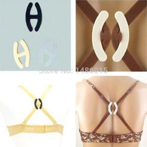 Woman in bra strap clip set Black color, front view, showing oval design.