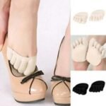 Woman in silicone anti slip socks Black color, front view, showing grip lining.