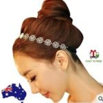 Woman in gold rose headband Gold color, front view, showing rose design.
