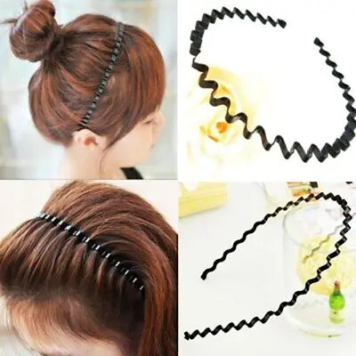 1-401-1.jpg Person in wavy sport headband Black color, front view, showing alloy design.