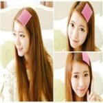 Woman using magic bangs fixing clips Multi-Colored, front view, showing plastic design.