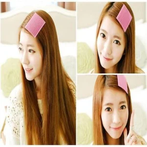 Woman using magic bangs fixing clips Multi-Colored, front view, showing plastic design.