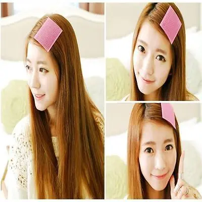 1-405-1.jpg Woman using magic bangs fixing clips Multi-Colored, front view, showing plastic design.