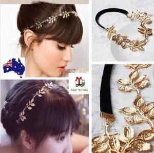 Woman in gold leaf wedding tiara Golden color, front view, showing leaf flower design.