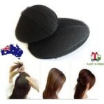 Woman using fluffy updo sponge pad Black color, front view, showing sponge design.