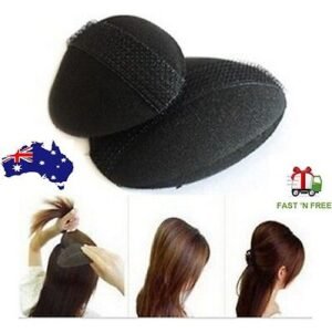 Woman using fluffy updo sponge pad Black color, front view, showing sponge design.