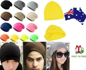 Person in hip hop beanie hat Australia Black color, front view, showing baggy design.