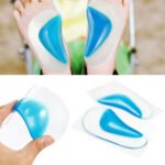 Child with child flat feet insoles Australia Clear with blue cushion, front view, showing gel pad.
