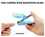 Person with nail clipper with magnifier Australia Blue color, front view, showing magnifier.