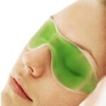 Person with gel eye mask Australia Shown color, front view, showing elastic rope design.