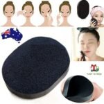 Person with bamboo charcoal facial puff Australia Shown color, front view, showing porous design.