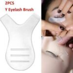 Person with eyelash cleaning brush Australia Shown color, front view, showing Y-shape design.