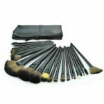 Person with makeup brush set Australia Black color, front view, showing angled design.