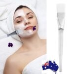 Person with DIY facial mask brush Australia White color, front view, showing soft hair design.