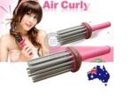 Person with airy curl styler Australia Rose color, front view, showing comb design.
