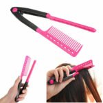 Person with folding V comb hair straightener Australia Shown color, front view, showing V-shape.