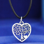 Person with tree of life choker Australia Black color, front view, showing heart pendant.