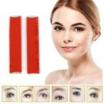 Person with microblading needle Australia Stainless steel color, front view, showing 14-pin blade.