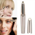 Person with mini eyebrow trimmer Australia Rose gold color, front view, showing LED light.