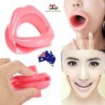 Person with face slimmer Australia Clear color, front view, showing mouthpiece.