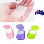 Person with travel soap sheets Australia Random color, front view, showing box and sheets.