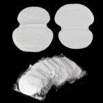 Person with underarm sweat pad Australia White/Skin color, front view, showing adhesive side.