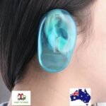 Person with ear cover shield Australia Blue color, front view, showing silicone fit.