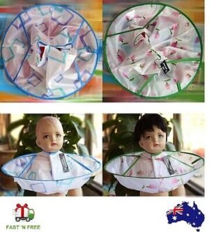 Person with kids haircut cape Australia Multicolor flower pattern, front view, showing waterproof cloth.