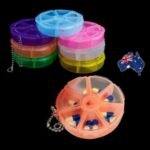 Person with pill box 7 days Australia Blue color, front view, showing 7 slots.