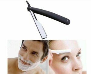 Person with straight edge razor Australia Black/Beige color, front view, showing folded design.