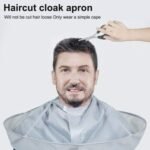 Person with hair cutting cloak Australia Gray color, front view, showing umbrella design.