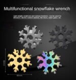 Person with multi-tool keychain Australia Silver/Black color, front view, showing snowflake design.