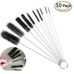 Person with straw brush cleaner Australia Black/White color, front view, showing 10-piece set.