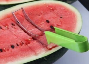 Person with watermelon slicer Australia Random color stainless steel, front view, showing blade.