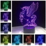 Person with unicorn night light Australia Clear acrylic color, front view, showing 3D wings.