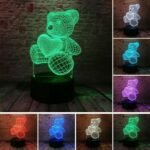 Person with teddy bear night light Australia Clear acrylic color, front view, showing 3D teddy.