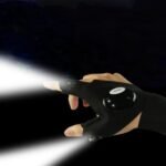 Person with fishing gloves Australia Black color, front view, showing LED lights.