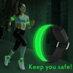 Person with LED armband Australia Red color, front view, showing reflective strip.