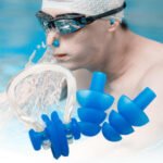 Person with swim earplug set Australia Blue color, front view, showing nose clip and earplugs.