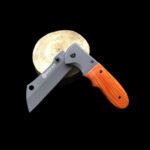 Person with folding knife Australia Dark brown color, front view, showing wood handle.