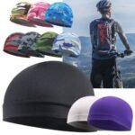 Person with cycling hat Australia Black color, front view, showing windproof design.