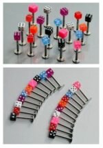 Person with dice labret piercing Australia Black color, front view, showing dice design.